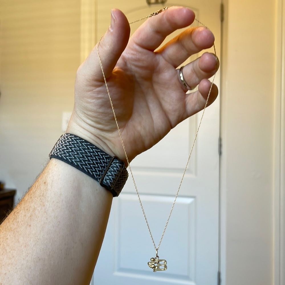 Delicate gold B necklace with angel on the side